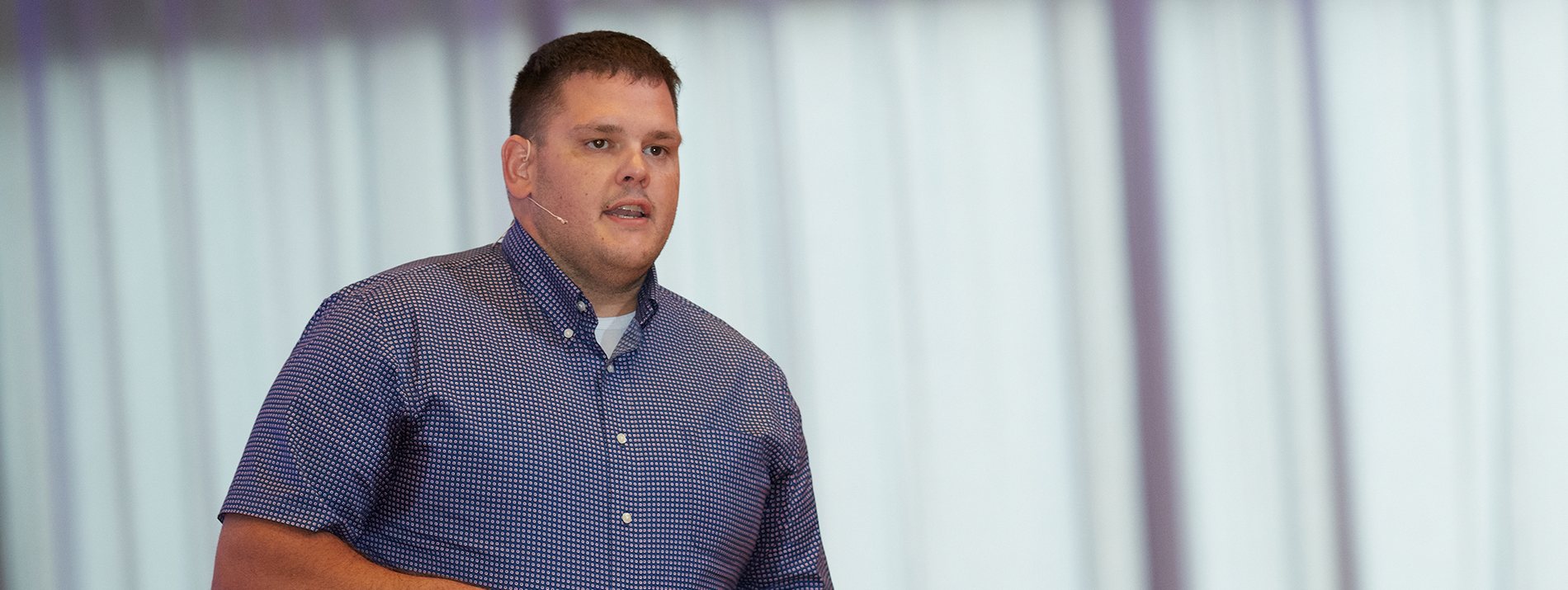 A man talking during a presentation.